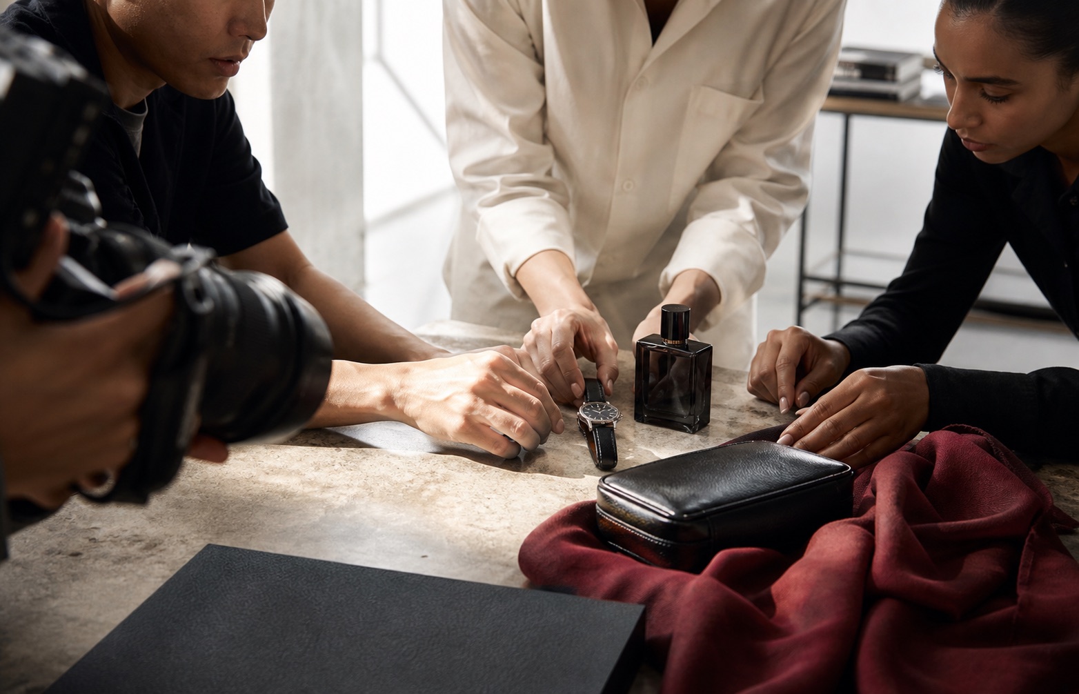 Creative team styling premium objects for an editorial creator shoot