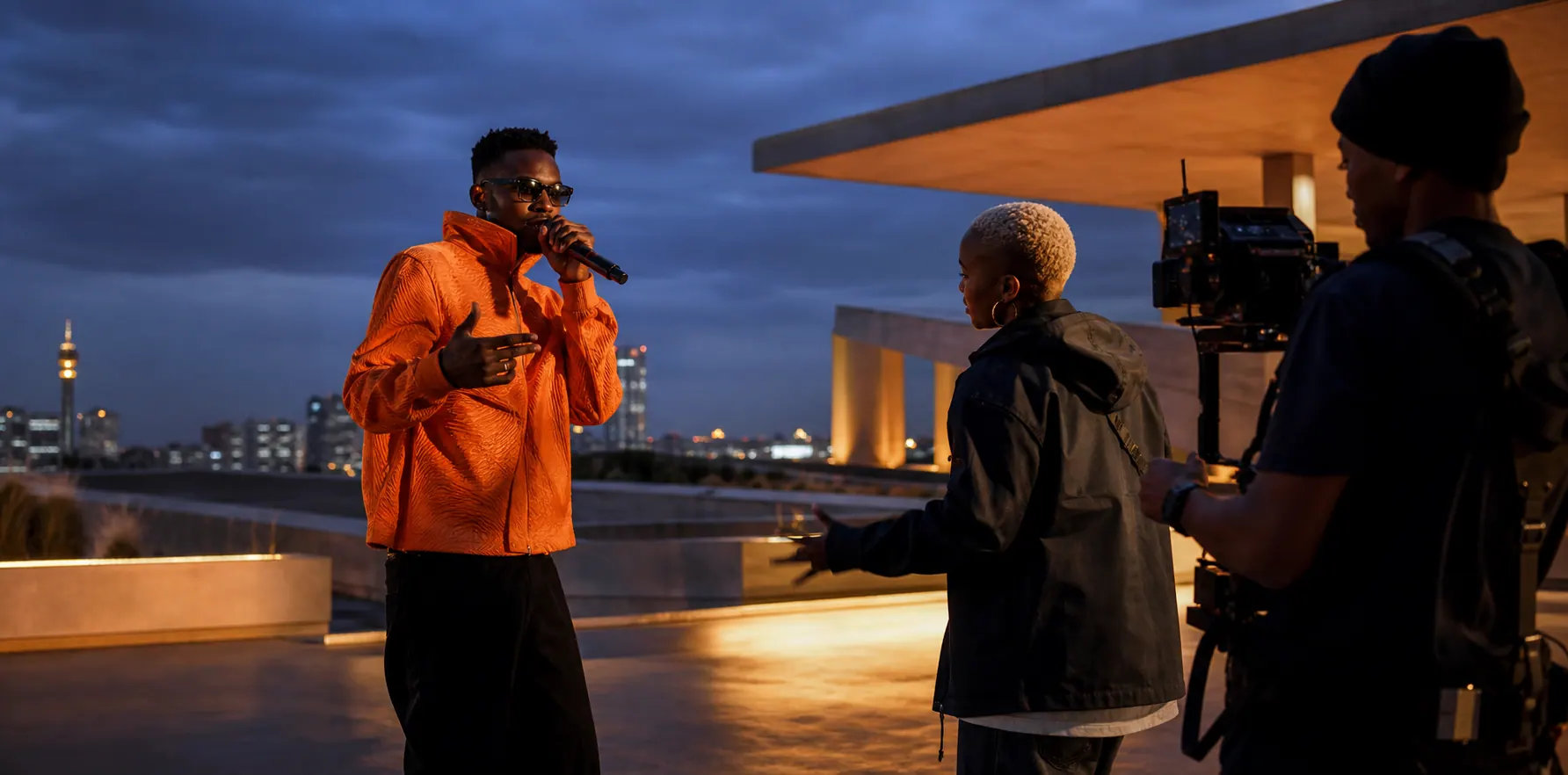 Creator performing at a live rooftop activation while a production team films
